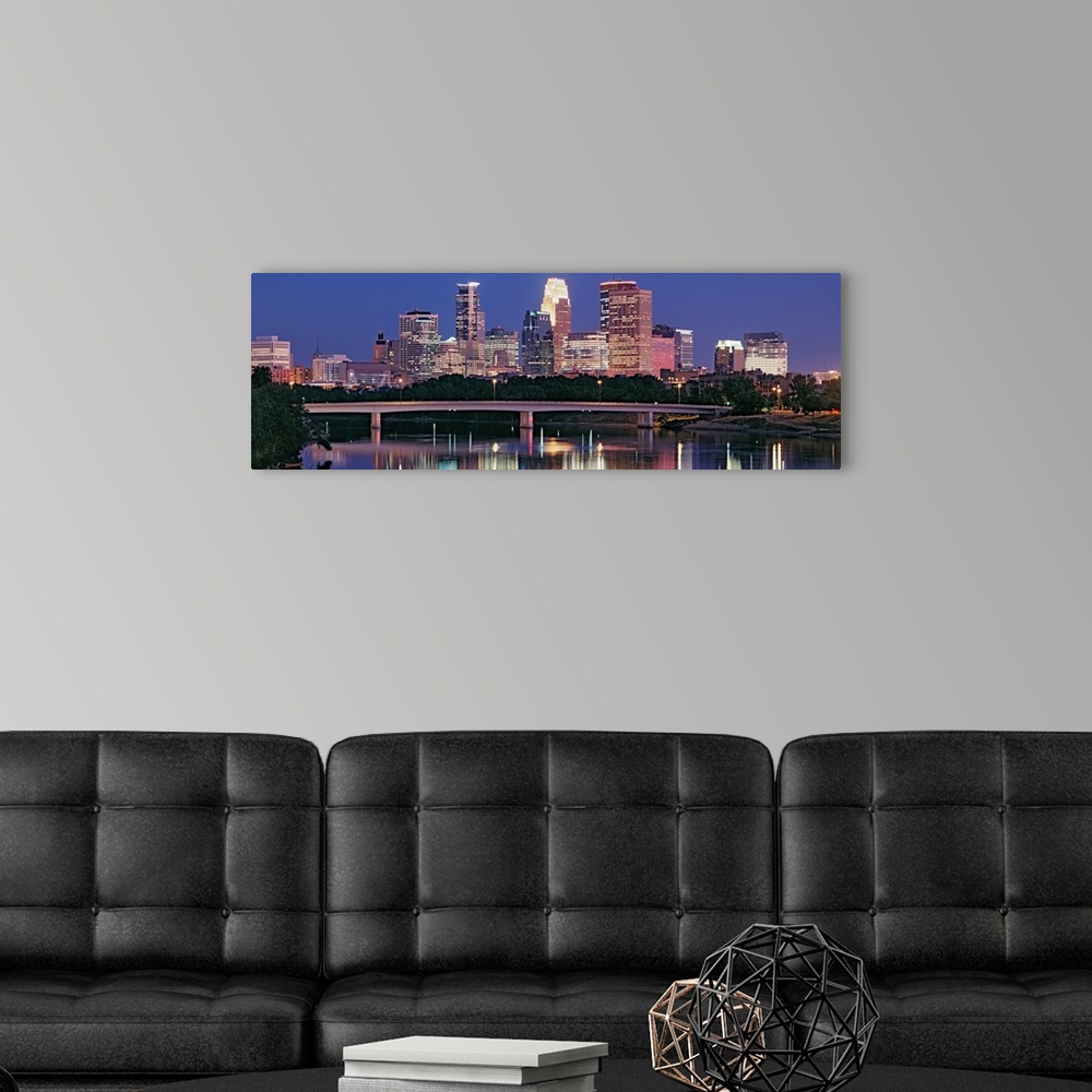 A modern room featuring Panoramic photograph includes a nighttime skyline for the largest city in Minnesota.  The gently ...