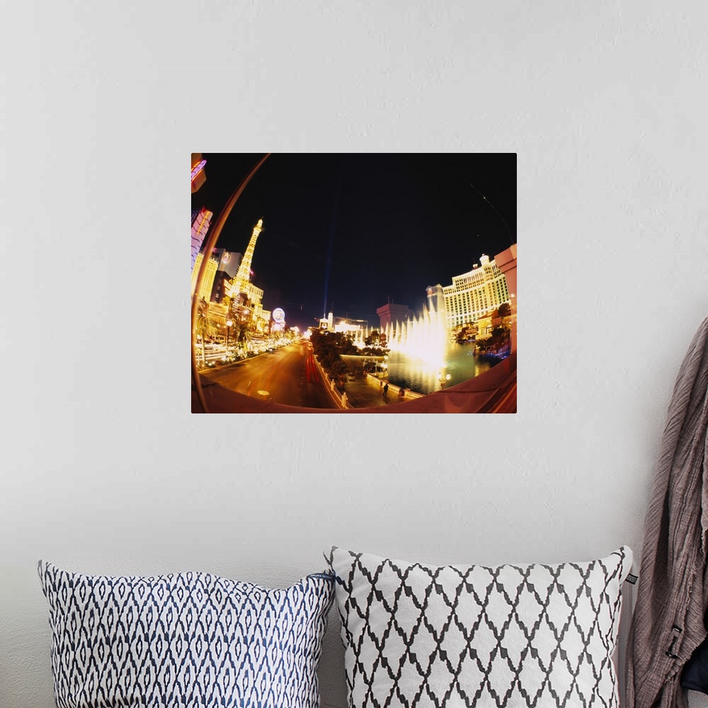 A bohemian room featuring Big photograph of downtown Las Vegas, Nevada (NV) lit up at night.
