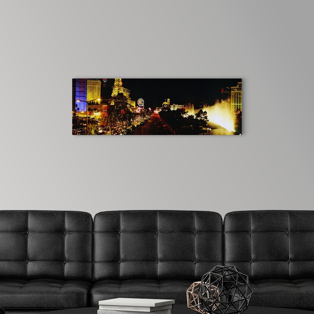 A modern room featuring Panoramic photograph displays the brightly lit strip of Las Vegas, Nevada filled with hotels, cas...
