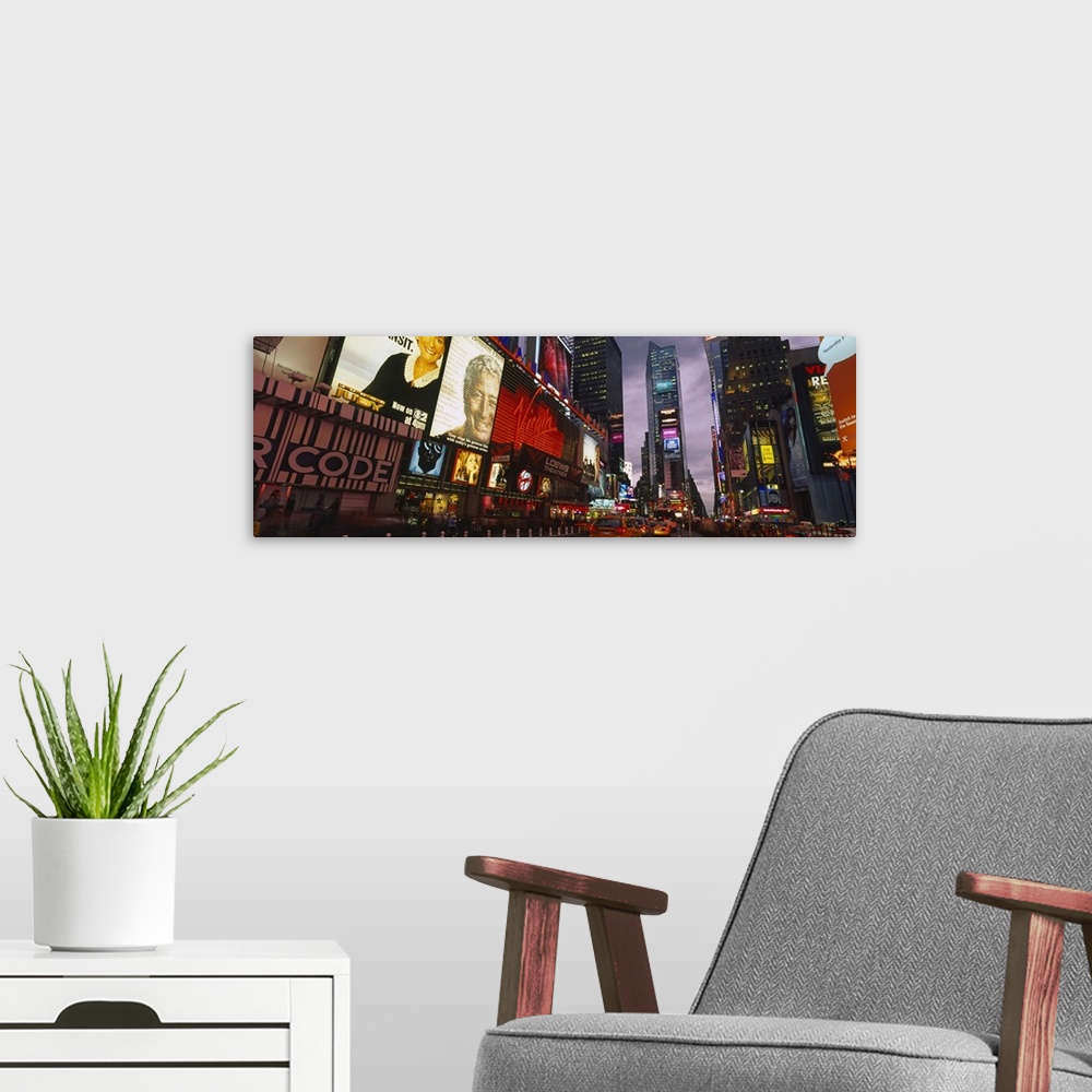 A modern room featuring This wall hanging for a home or office is a panoramic photograph taken at street level of the eno...