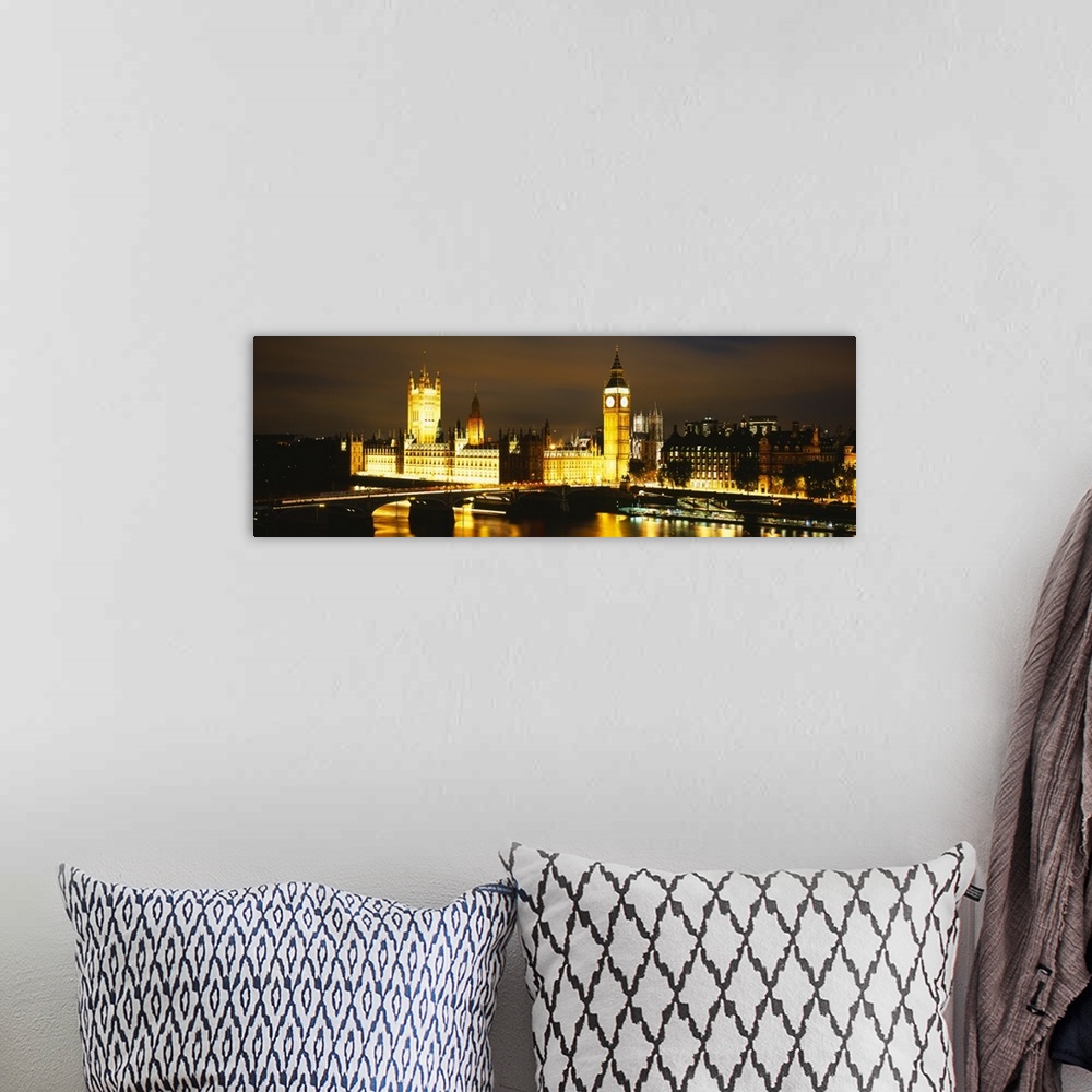 A bohemian room featuring This panoramic piece shows the Big Ben clock tower and the House of Parliament illuminated under ...