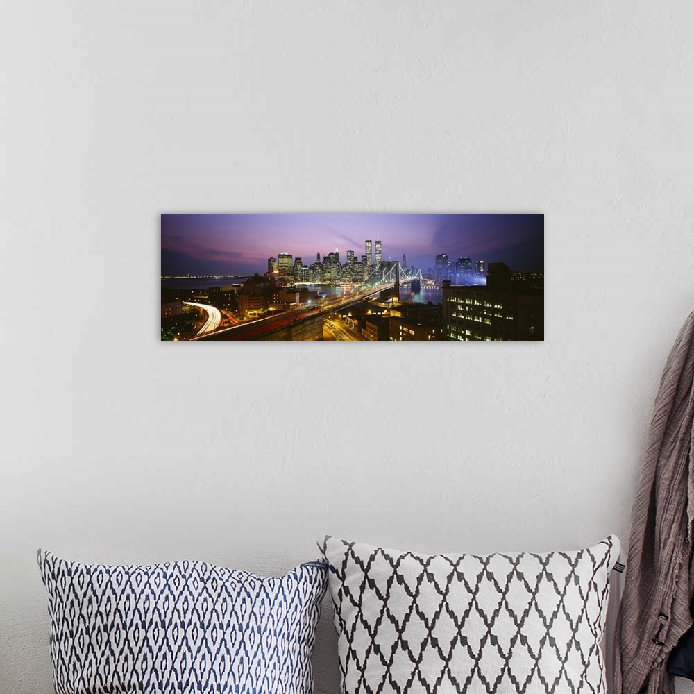 A bohemian room featuring Panoramic image of lower Manhattan lit up at night with the World Trade Center buildings  and the...