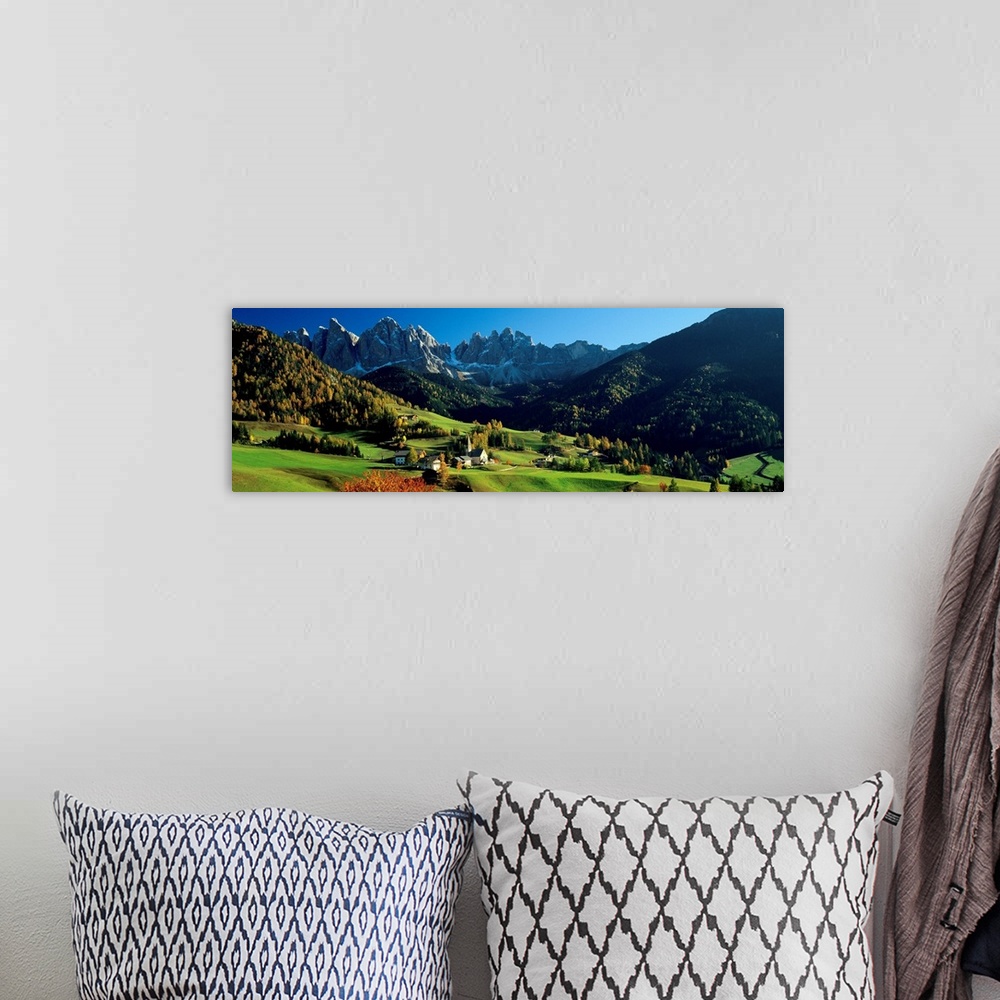 A bohemian room featuring Panoramic photograph shows an aerial view overlooking an open mountainous region of Europe that i...