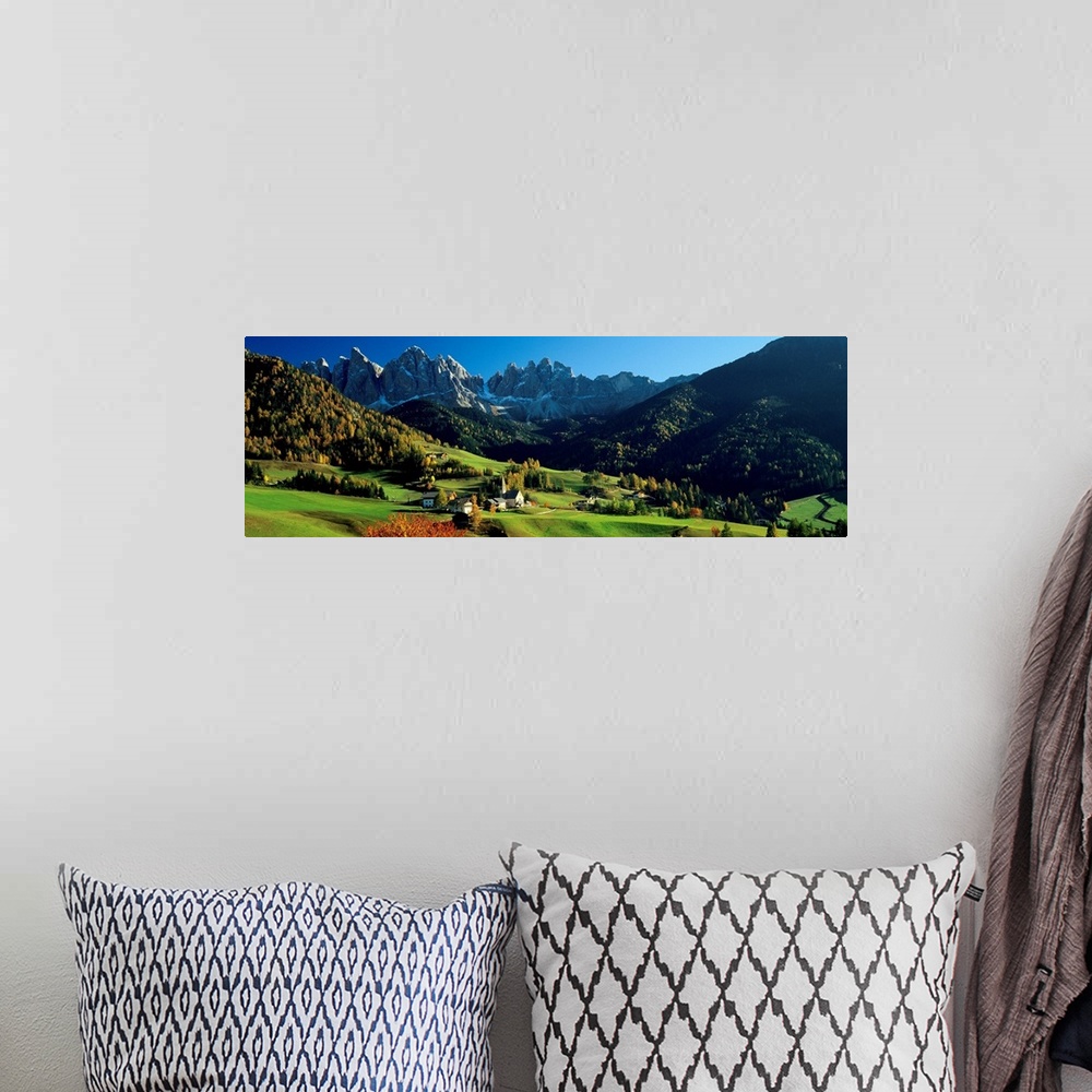 A bohemian room featuring Panoramic photograph shows an aerial view overlooking an open mountainous region of Europe that i...