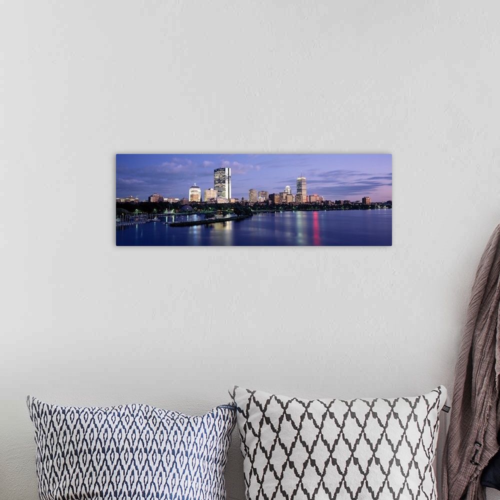 A bohemian room featuring This panoramic photograph is taken at sun down of the Boston skyline with a body of water shown i...