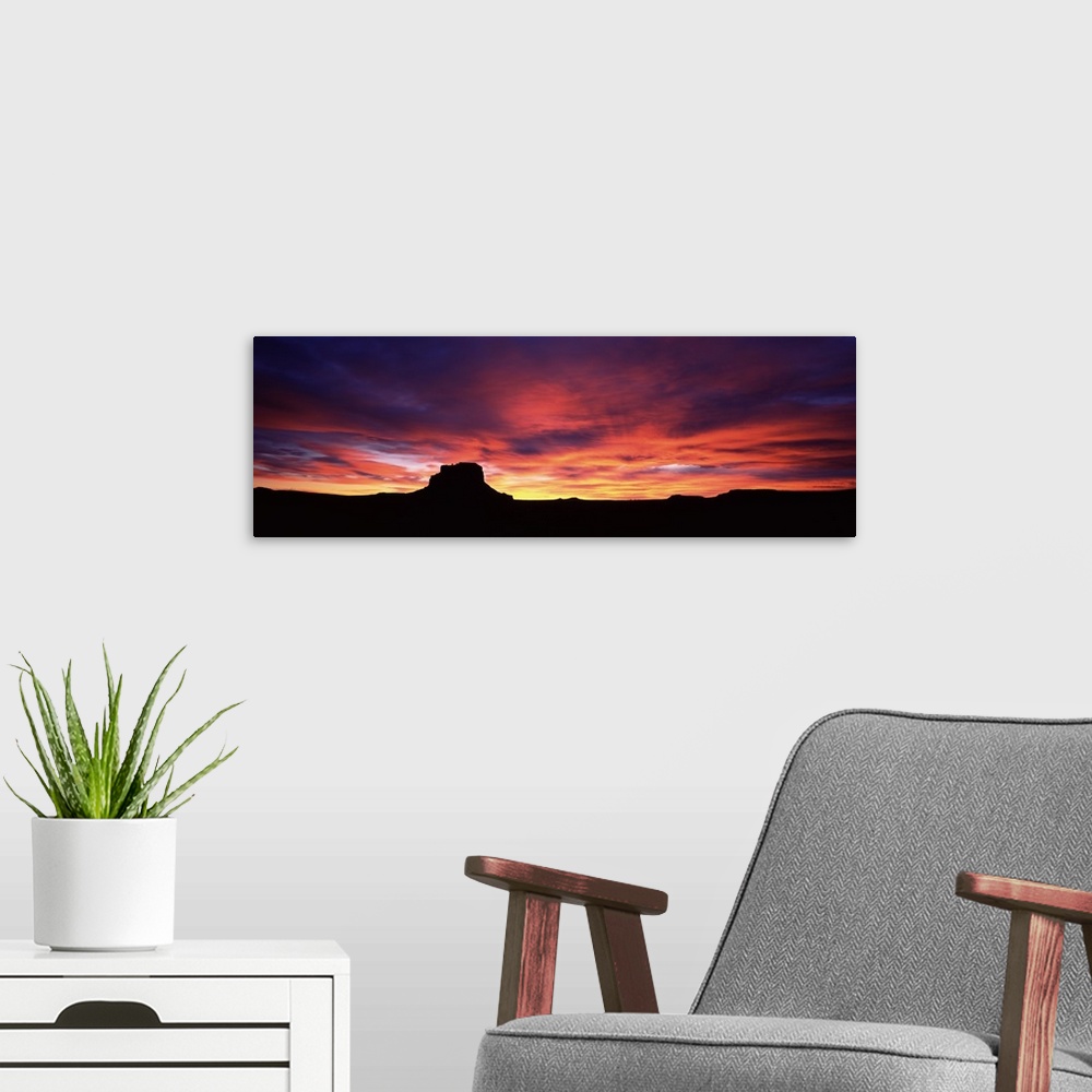 A modern room featuring Silhouette of the buttes as the sun sets over the Chaco Culture National Historic Park in New Mex...