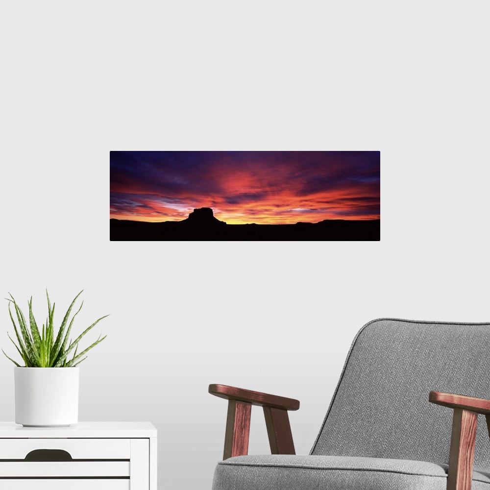A modern room featuring Silhouette of the buttes as the sun sets over the Chaco Culture National Historic Park in New Mex...