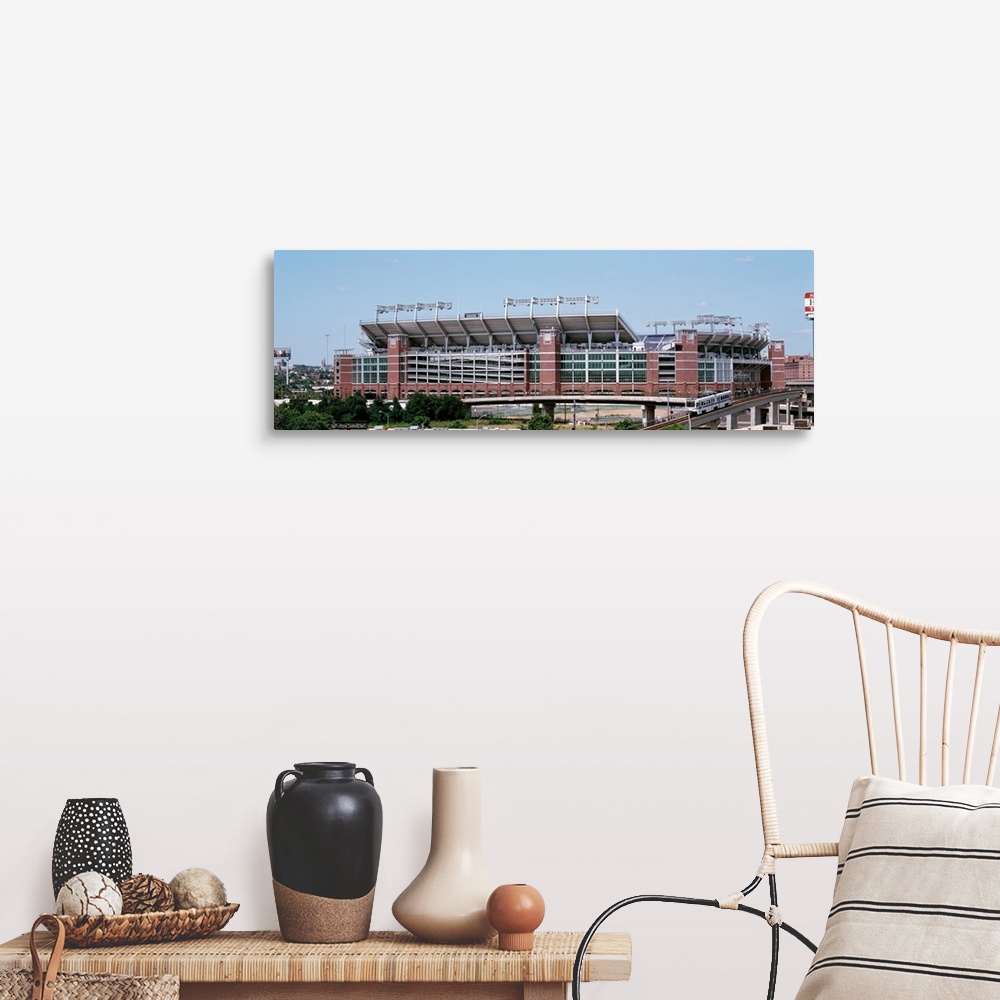 A farmhouse room featuring Giant, horizontal photograph taken from a hanging cable car of the outside of M & T Back Stadium ...