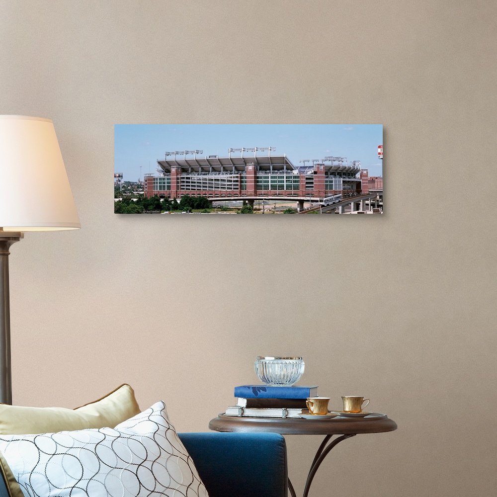 A traditional room featuring Giant, horizontal photograph taken from a hanging cable car of the outside of M & T Back Stadium ...