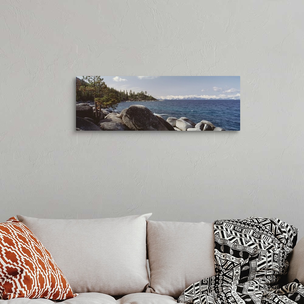 A bohemian room featuring Panoramic photograph of the rocky shore of Lake Tahoe in California.
