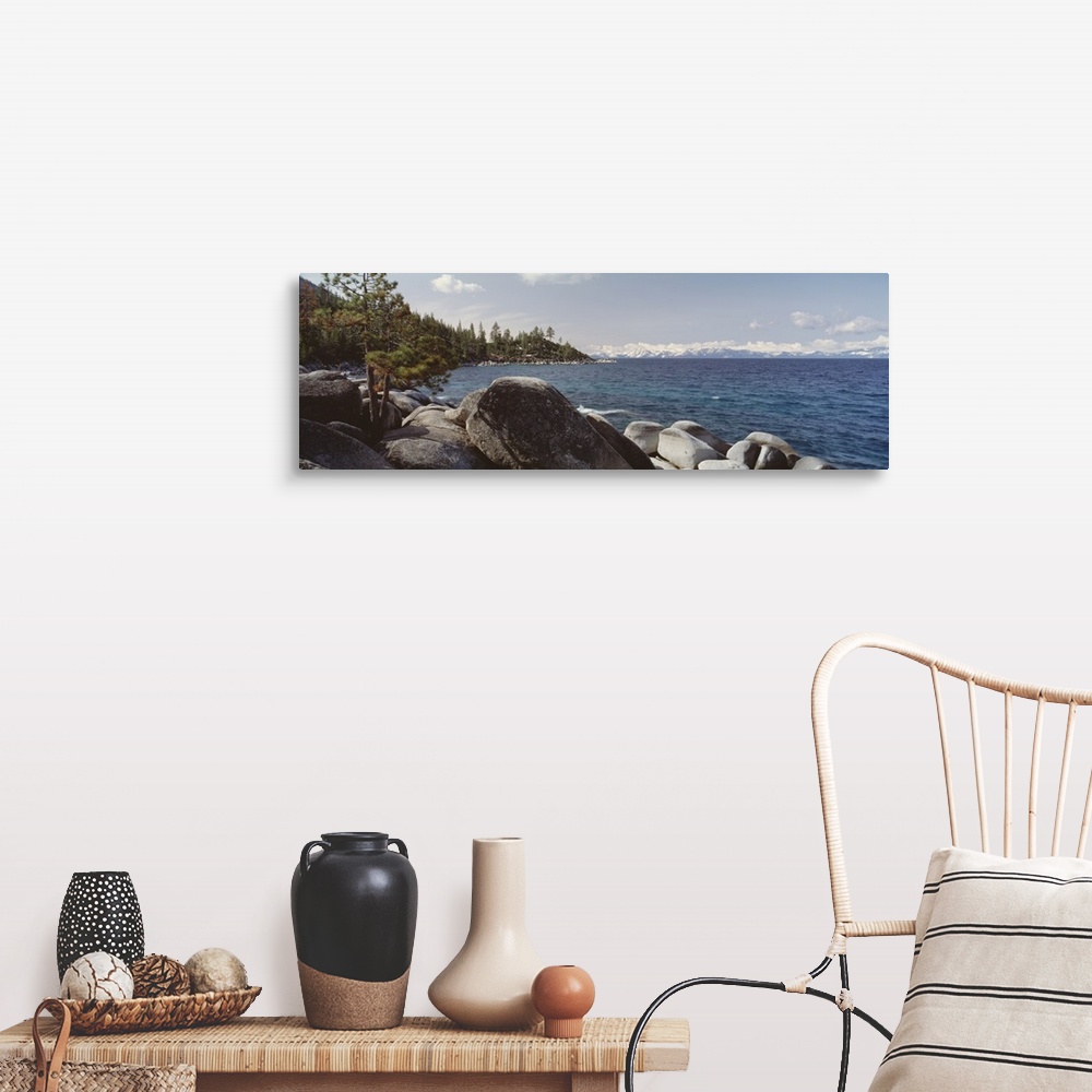 A farmhouse room featuring Panoramic photograph of the rocky shore of Lake Tahoe in California.