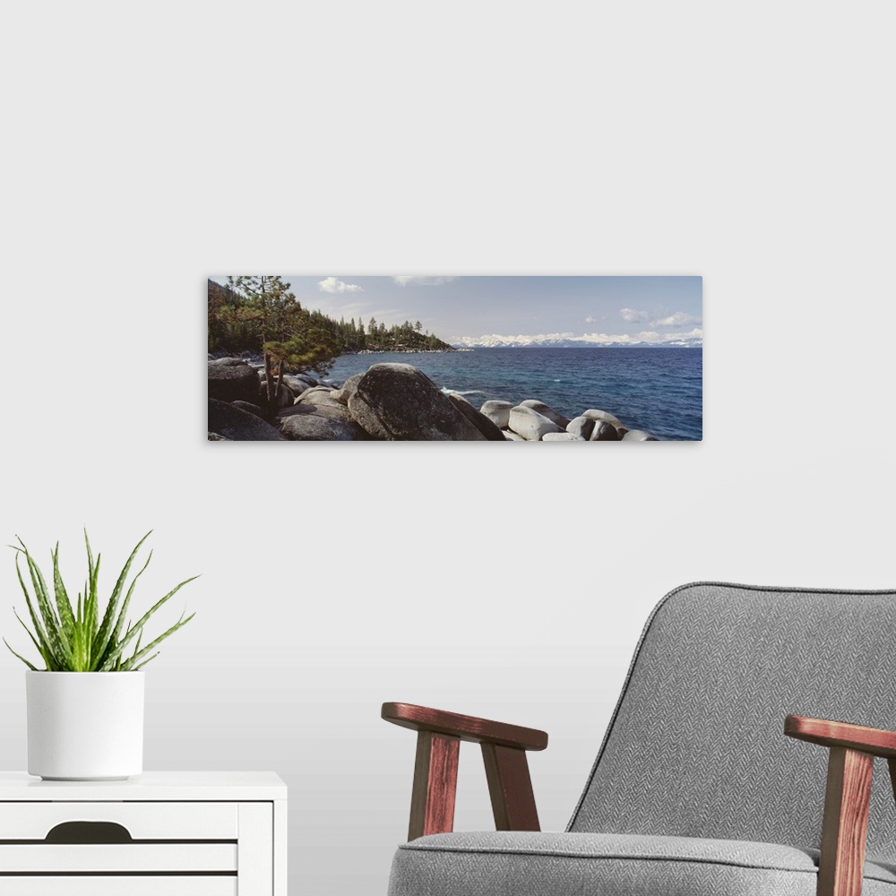 A modern room featuring Panoramic photograph of the rocky shore of Lake Tahoe in California.