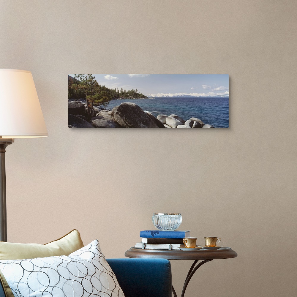 A traditional room featuring Panoramic photograph of the rocky shore of Lake Tahoe in California.