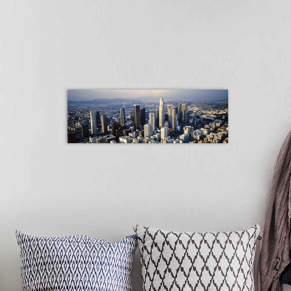 A bohemian room featuring Wide angle, aerial photograph on a big canvas of the city of Los Angeles beneath a slightly hazy ...