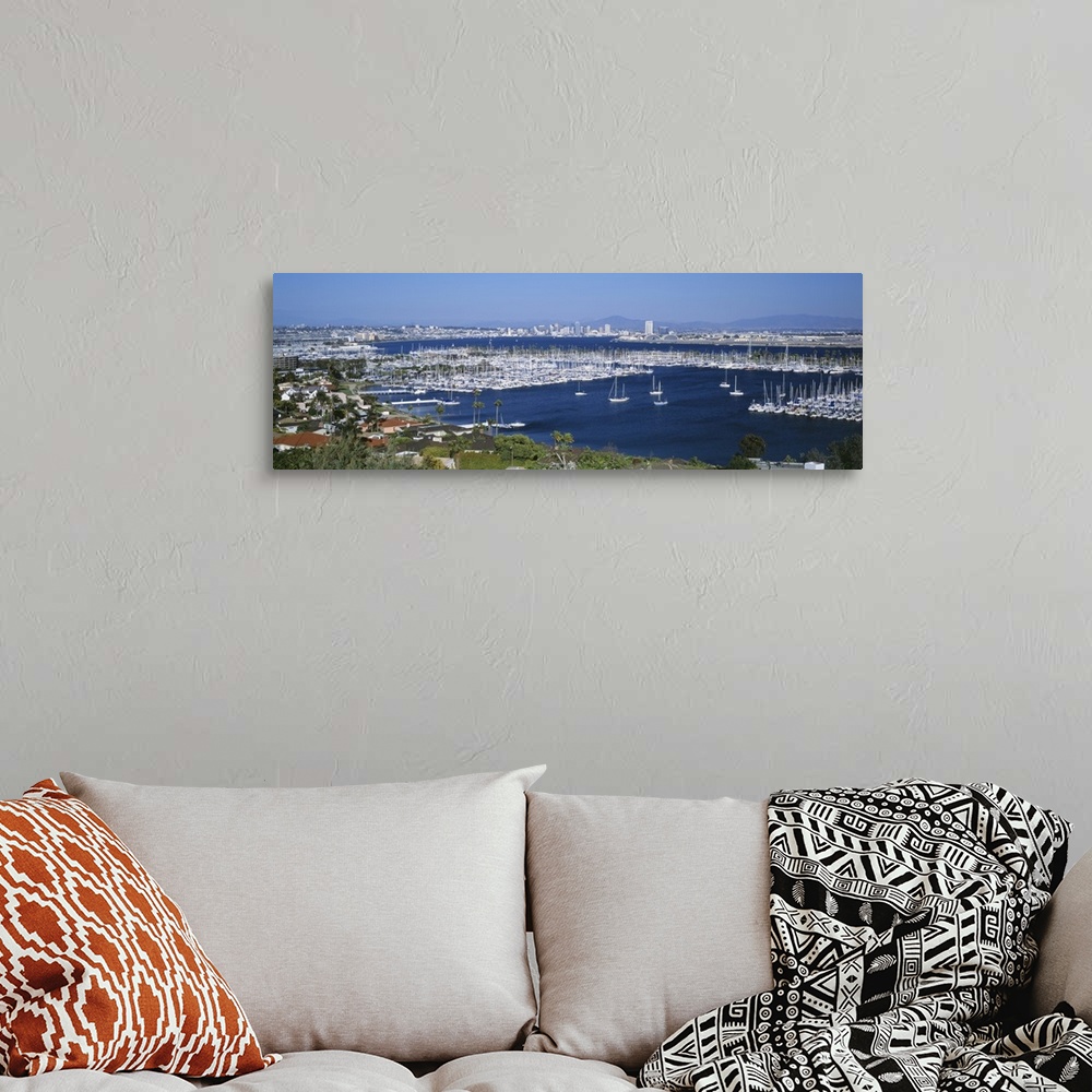 A bohemian room featuring A panoramic aerial view of the boats in the water of San Diego harbor.