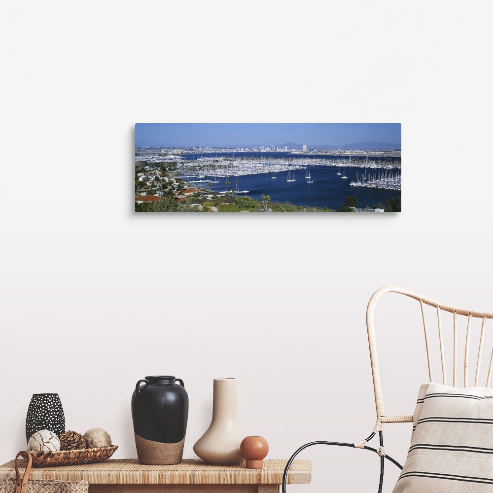 A farmhouse room featuring A panoramic aerial view of the boats in the water of San Diego harbor.
