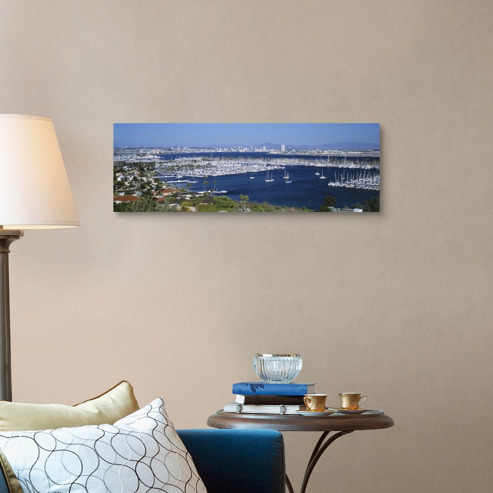 A traditional room featuring A panoramic aerial view of the boats in the water of San Diego harbor.