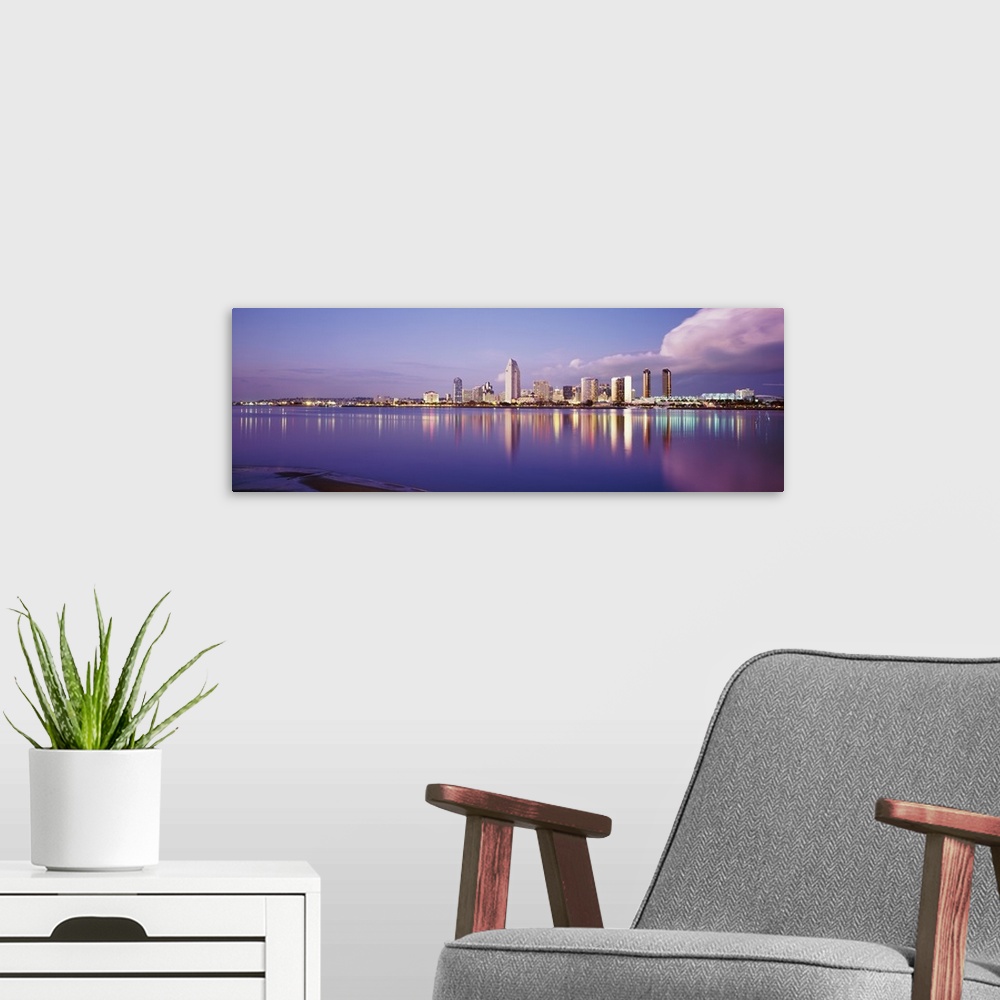 A modern room featuring Giant photograph on a landscape wall hanging of the San Diego skyline, including the financial di...