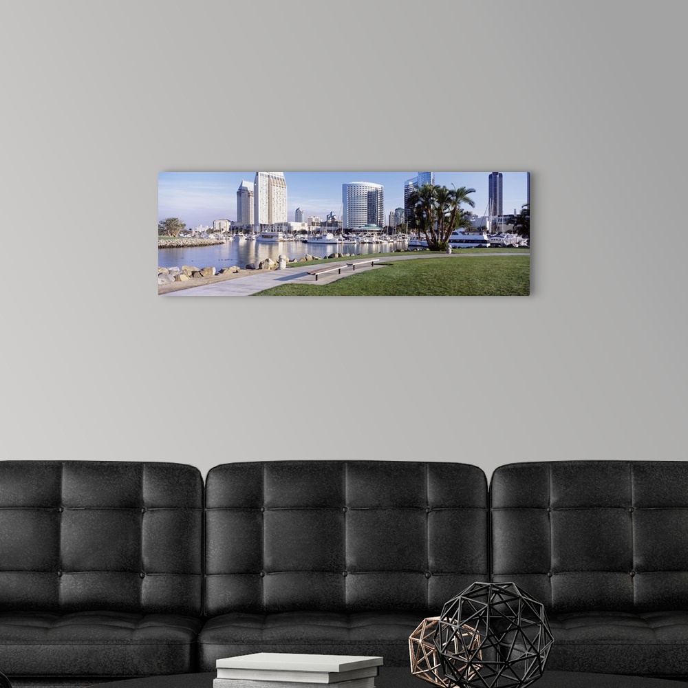 A modern room featuring View of San Diego, CA Marina Park with palm trees and skyline.