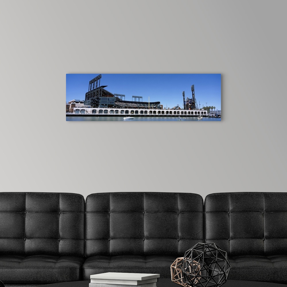 A modern room featuring The San Francisco Giants baseball stadium is photographed from the waterfront view.