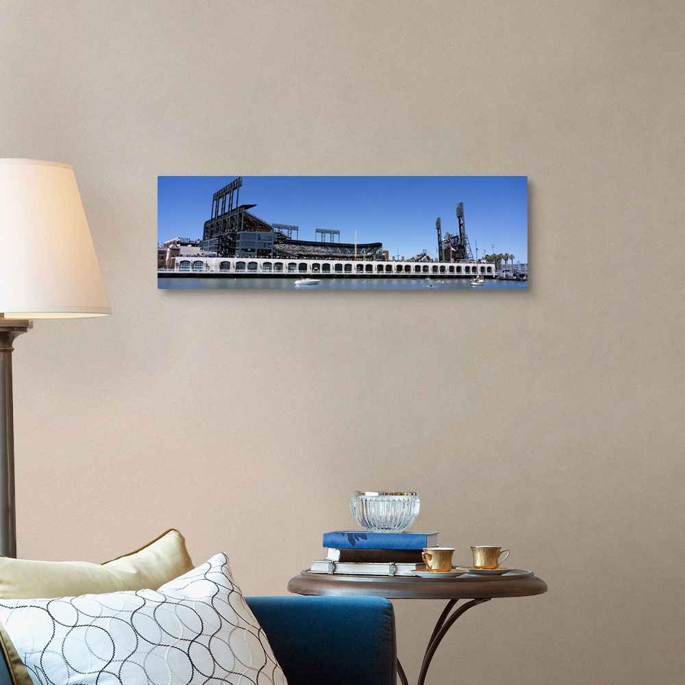 A traditional room featuring The San Francisco Giants baseball stadium is photographed from the waterfront view.
