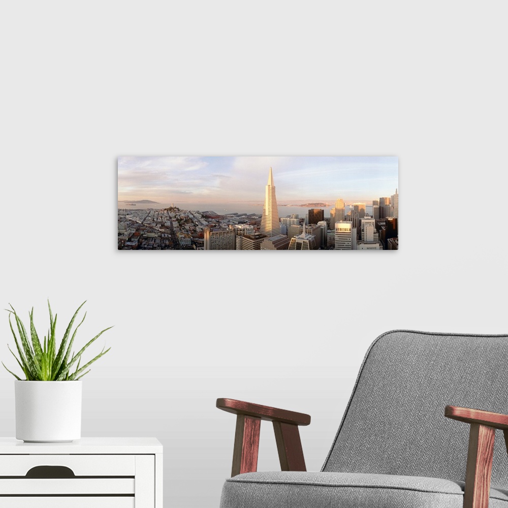 A modern room featuring Aerial photograph on a big canvas of the San Francisco skyline, including the Transamerica buildi...
