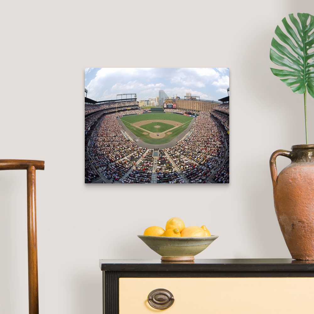 A traditional room featuring Big canvas print of a packed baseball stadium with a game going on in Maryland.
