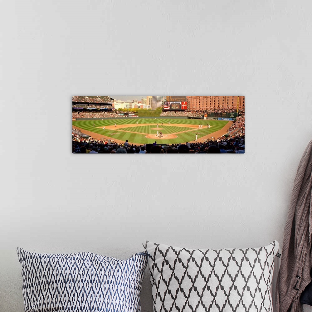 A bohemian room featuring Panoramic photograph taken of the stadium that is home to the Orioles of Major League Baseball as...