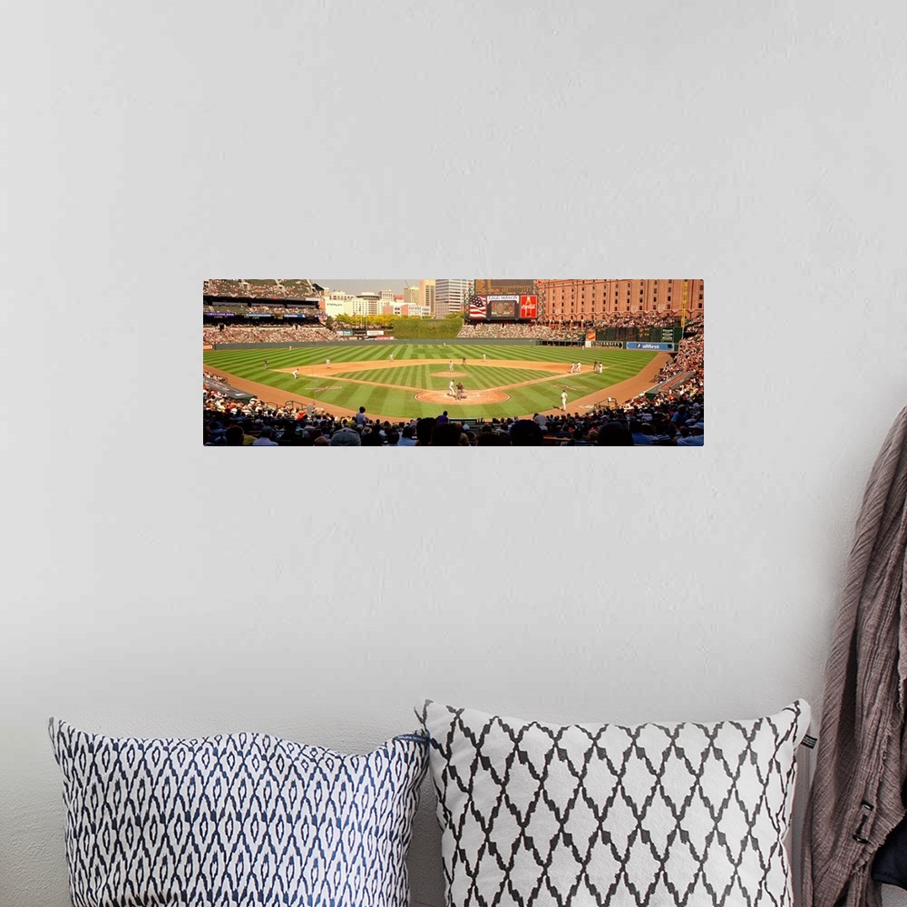 A bohemian room featuring Panoramic photograph taken of the stadium that is home to the Orioles of Major League Baseball as...