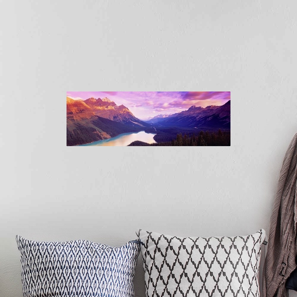 A bohemian room featuring A colorful sunrise over the mountains of Peyto Lake in Alberta, Canada.