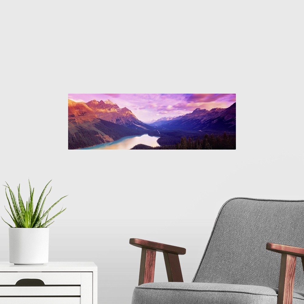 A modern room featuring A colorful sunrise over the mountains of Peyto Lake in Alberta, Canada.