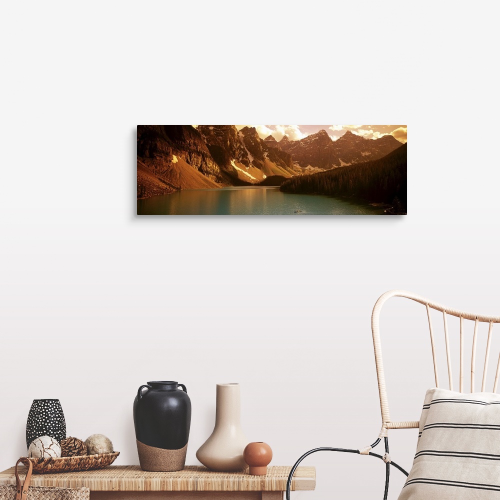 A farmhouse room featuring Panoramic photograph of waterfront surrounded by mountains under a cloudy sky.