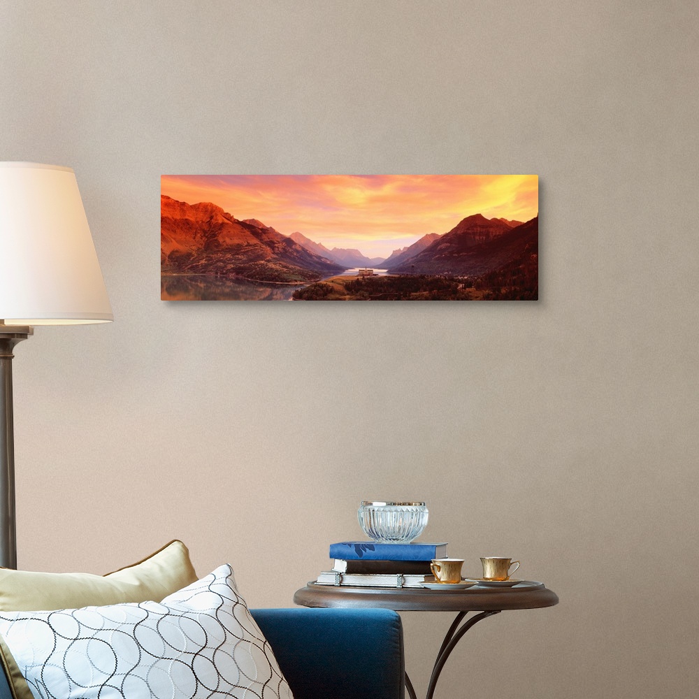 A traditional room featuring A panoramic photograph of the Canadian wilderness with mountains and trees reflecting in still la...