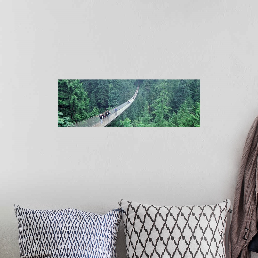 A bohemian room featuring Long horizontal photo on canvas of people walking across a long bridge that runs through the top ...