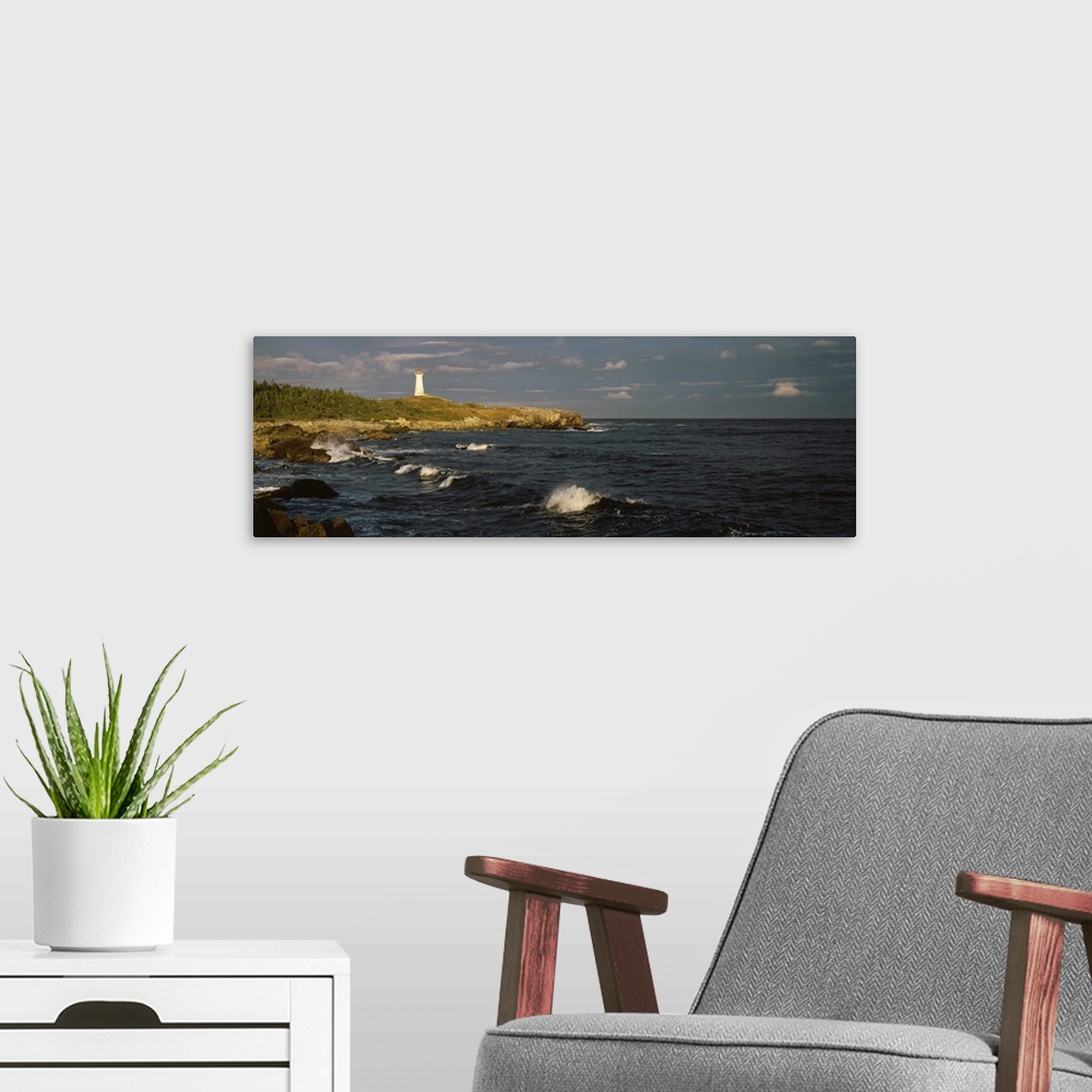 A modern room featuring Canada, Nova Scotia, Cape Breton Island, Louisburg lighthouse during sunset