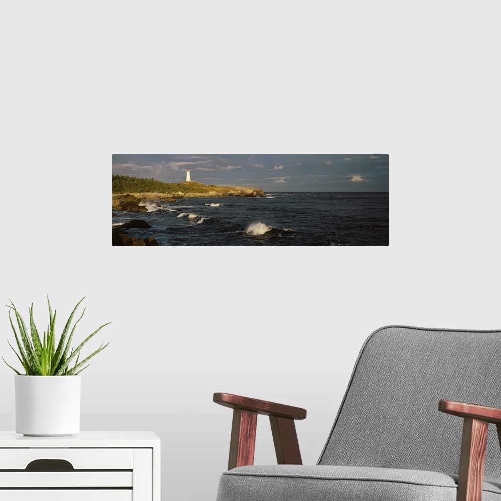 A modern room featuring Canada, Nova Scotia, Cape Breton Island, Louisburg lighthouse during sunset