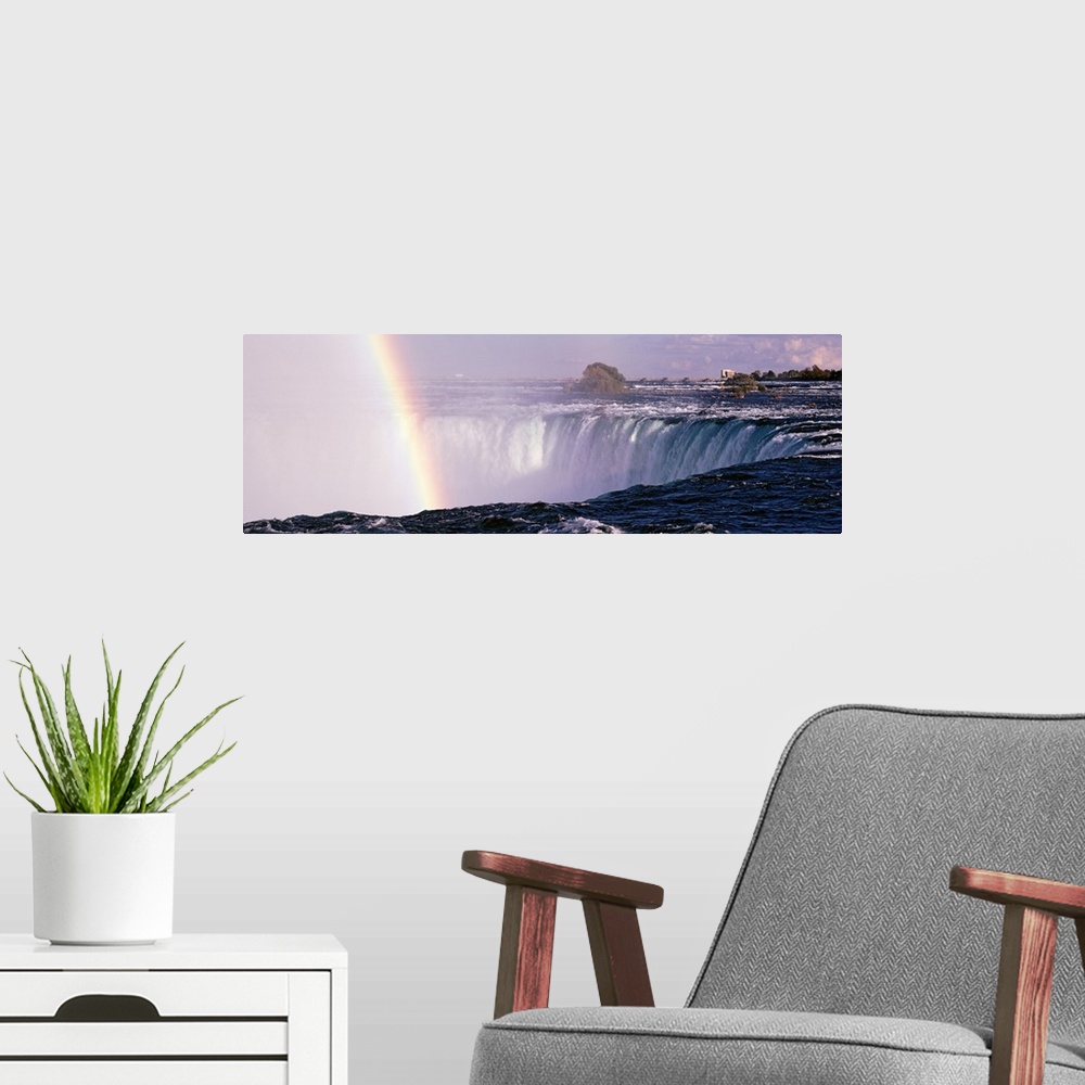 A modern room featuring This is a panoramic photograph taken from the Canadian side of this massive North American waterf...