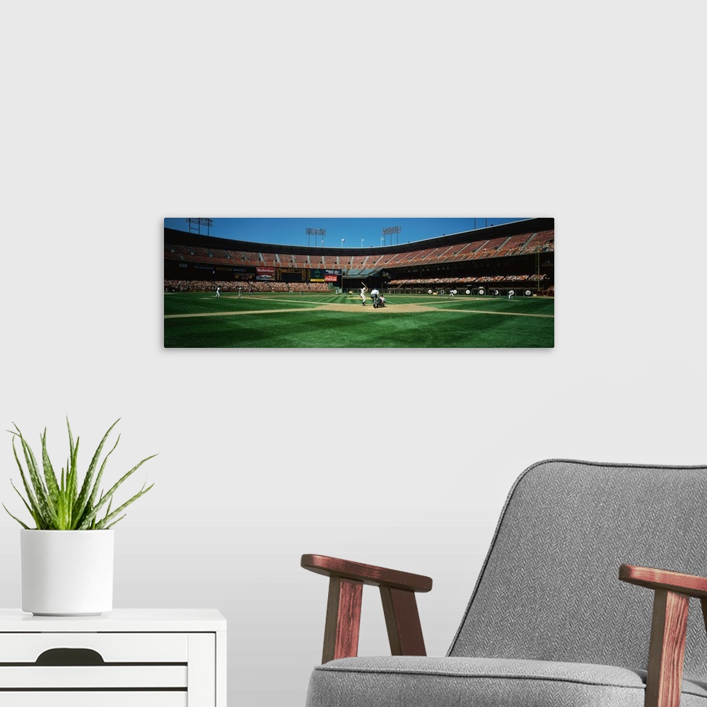 A modern room featuring Panoramic image on canvas of a baseball stadium as seen from the field behind the batter.
