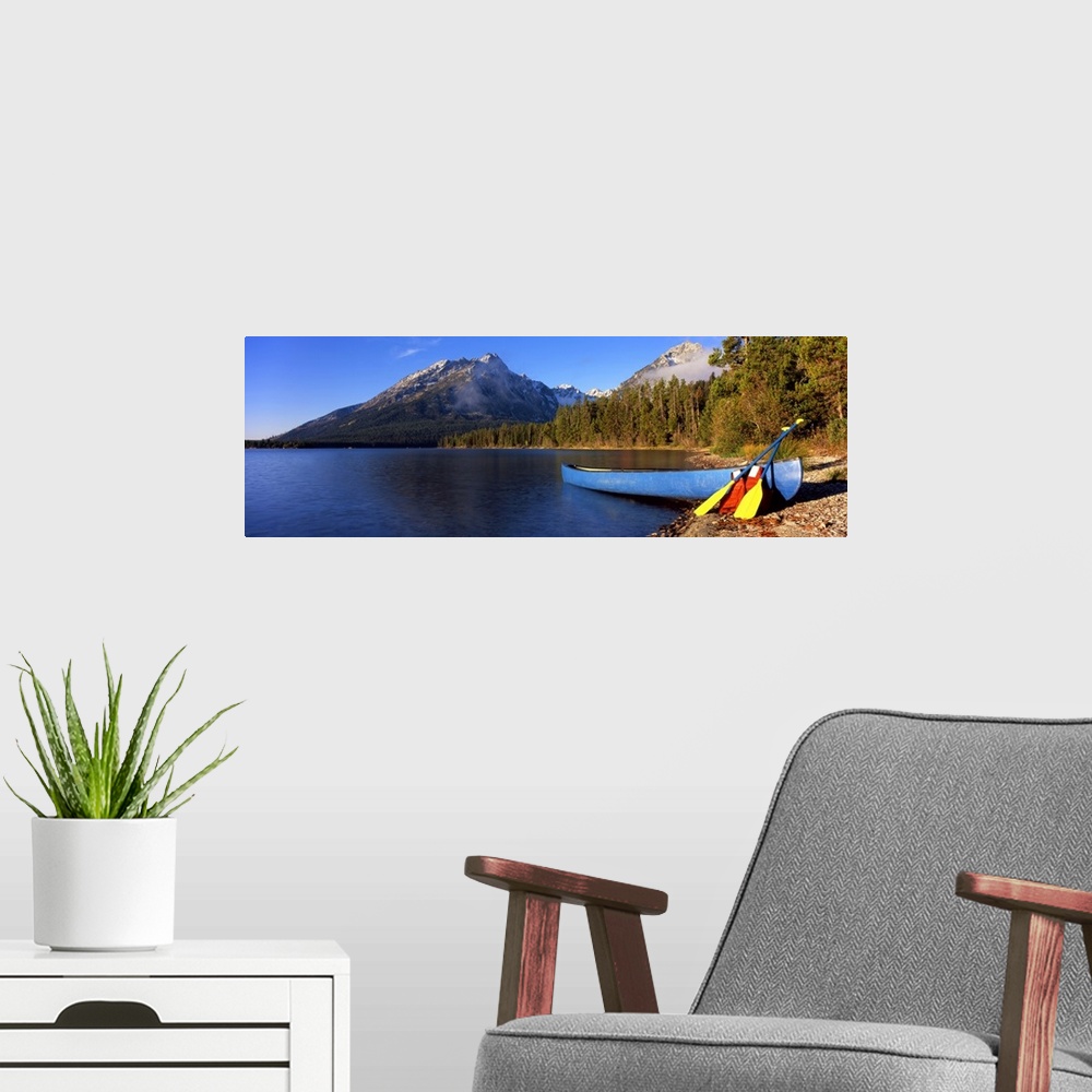 A modern room featuring Canoe in lake in front of mountains, Leigh Lake, Rockchuck Peak, Teton Range, Grand Teton Nationa...