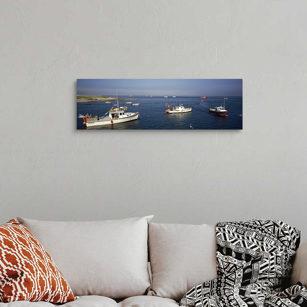 A bohemian room featuring Long and horizontal photo print of boats coming out of a harbor in Massachusetts.
