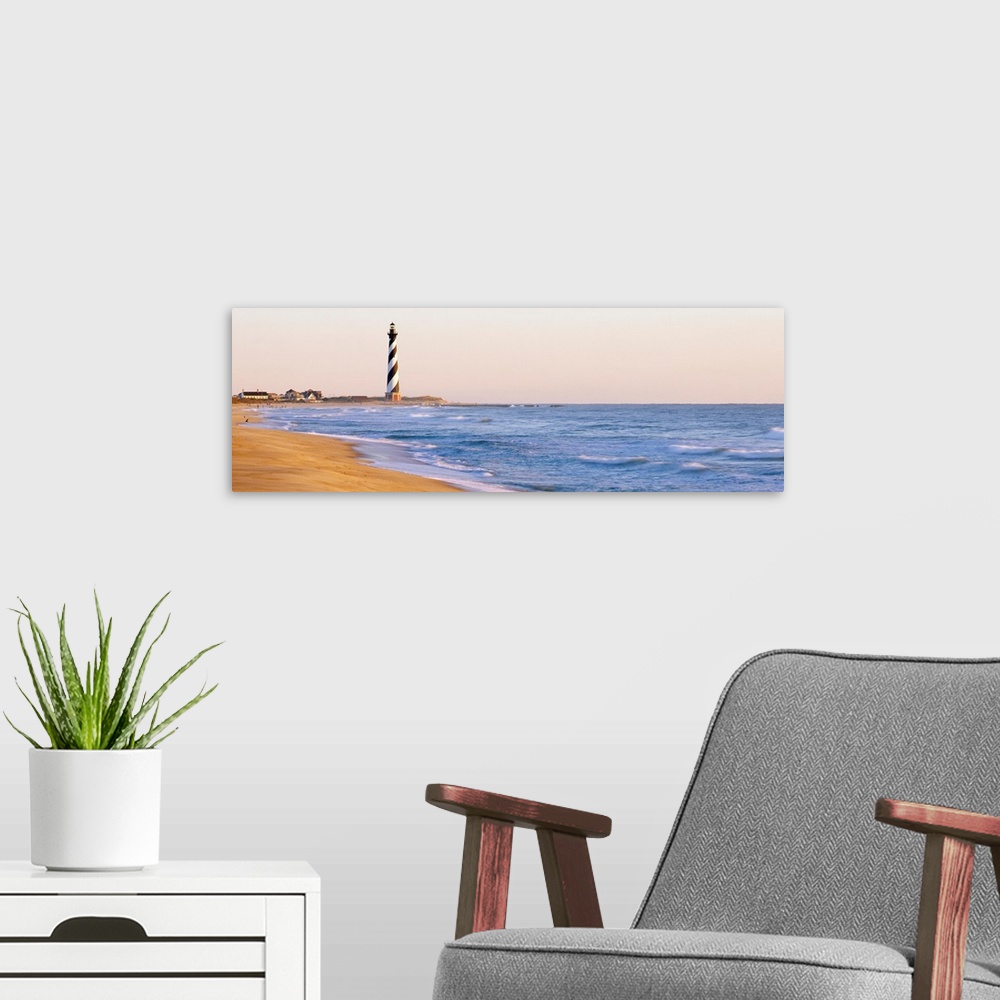 A modern room featuring This is panoramic wall art for the home or beach house of the famous OBX lighthouse from a distance.