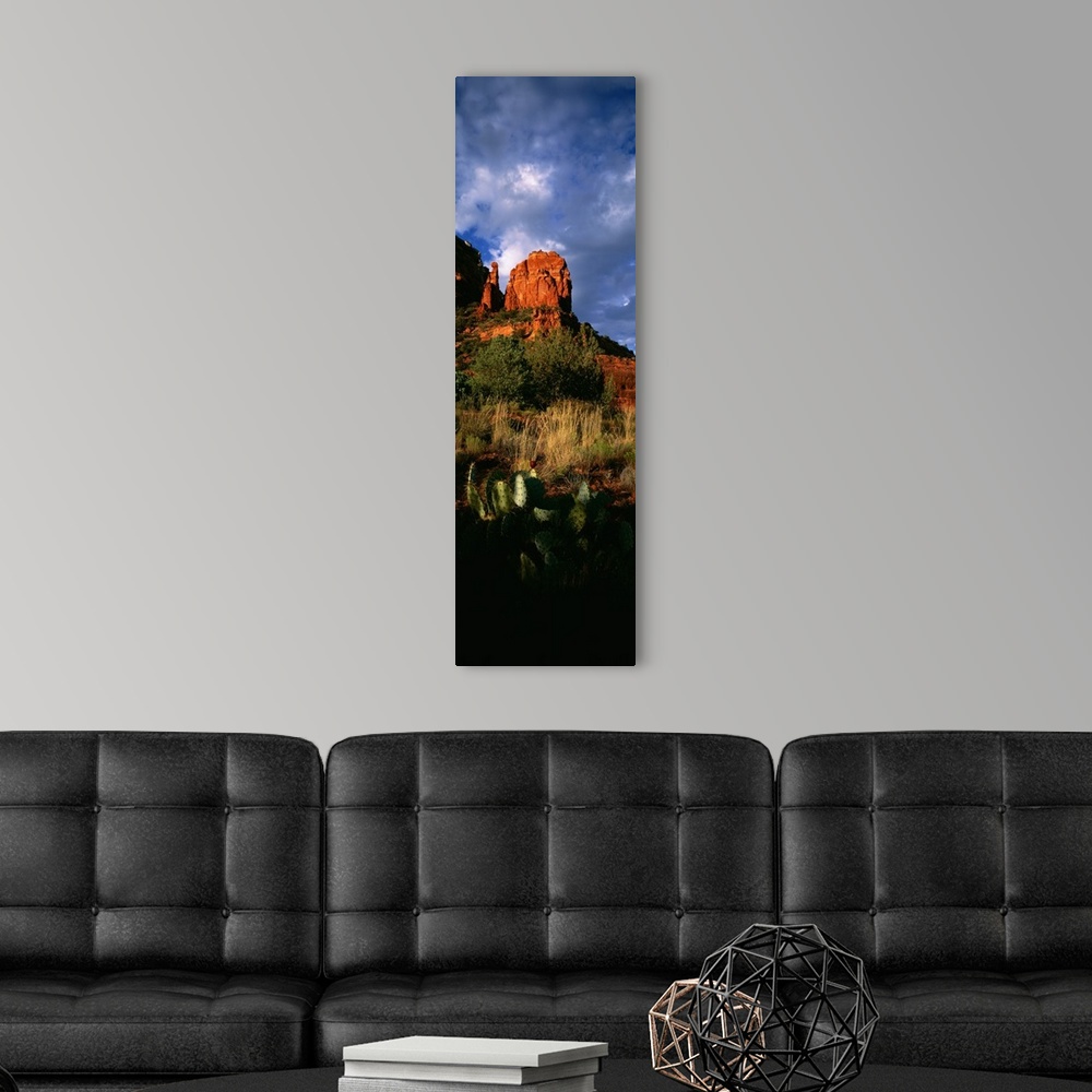 A modern room featuring A vertical panoramic of Thunder Mountain, one of the highest summits in Sedona Arizona on a cloud...