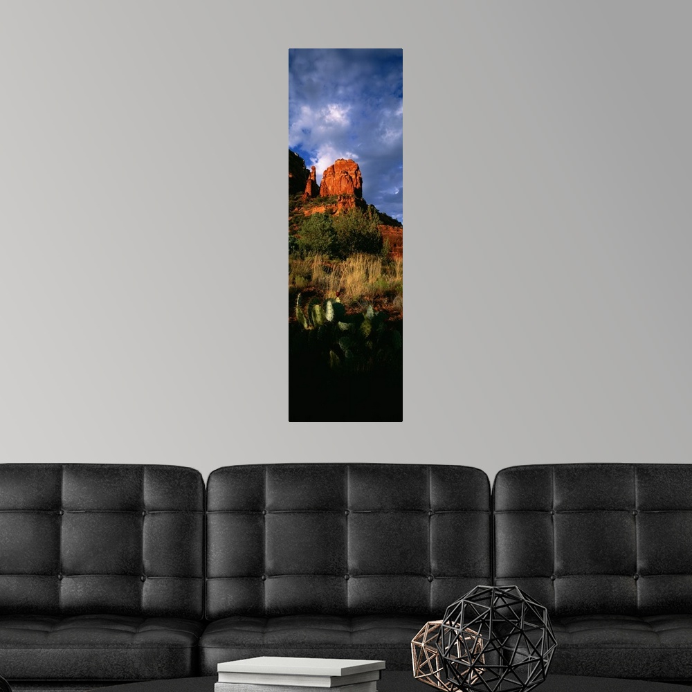 A modern room featuring A vertical panoramic of Thunder Mountain, one of the highest summits in Sedona Arizona on a cloud...