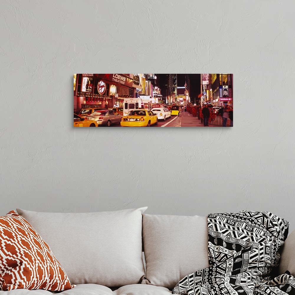 A bohemian room featuring Panoramic photograph of many cars and taxis filling the street in Times Square, surrounded by the...