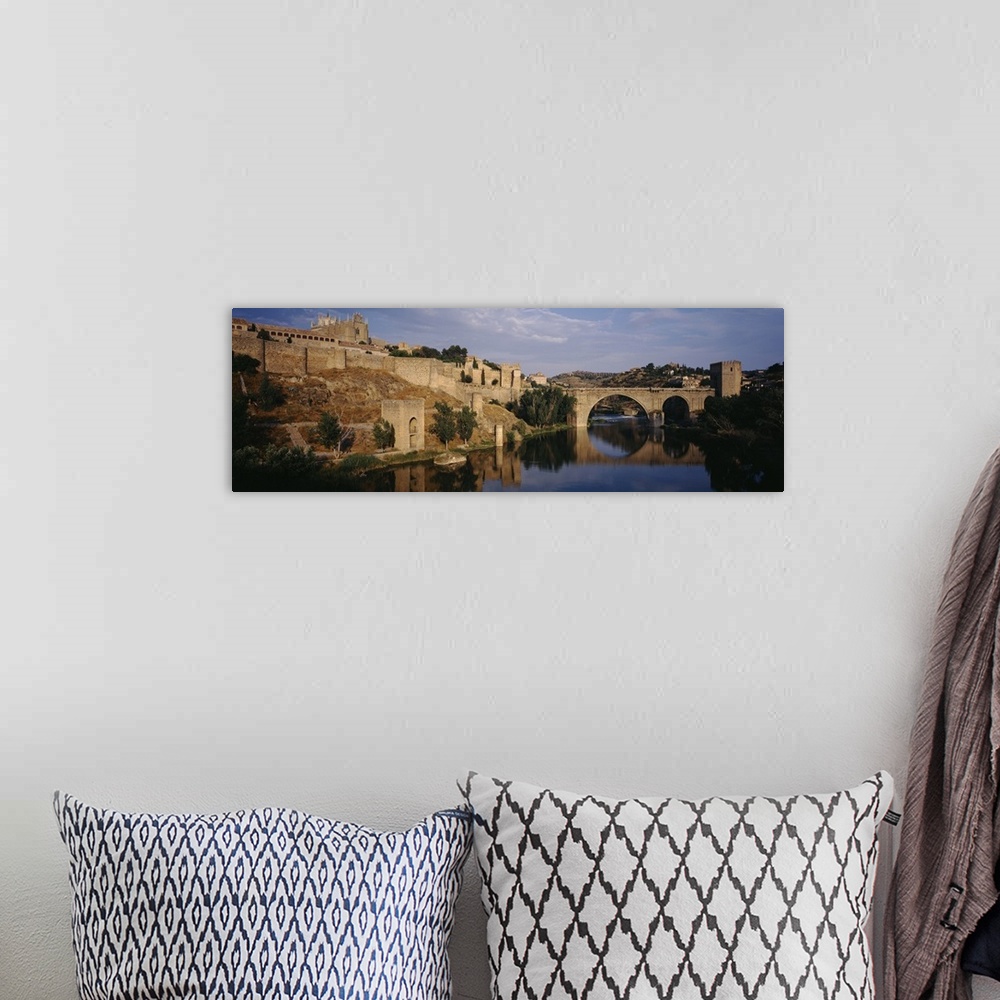A bohemian room featuring Castle at the waterfront, Puente de San Martin, Tajo River, Toledo, Spain