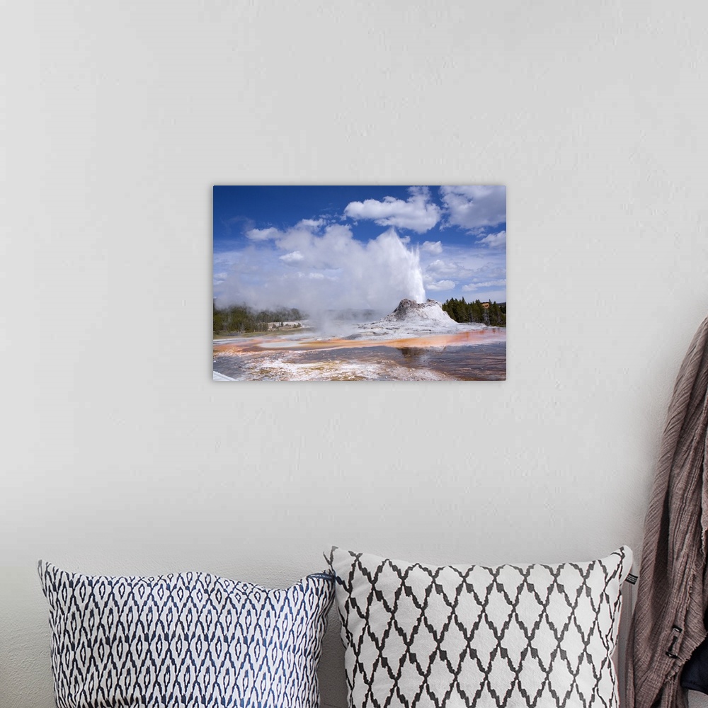 A bohemian room featuring Castle Geyser Erupting