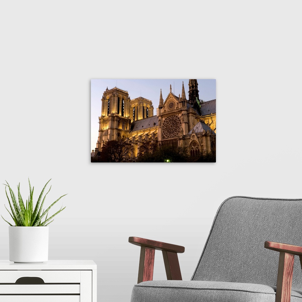 A modern room featuring Cathedral lit up at dusk, Notre Dame, Paris, Ile-De-France, France