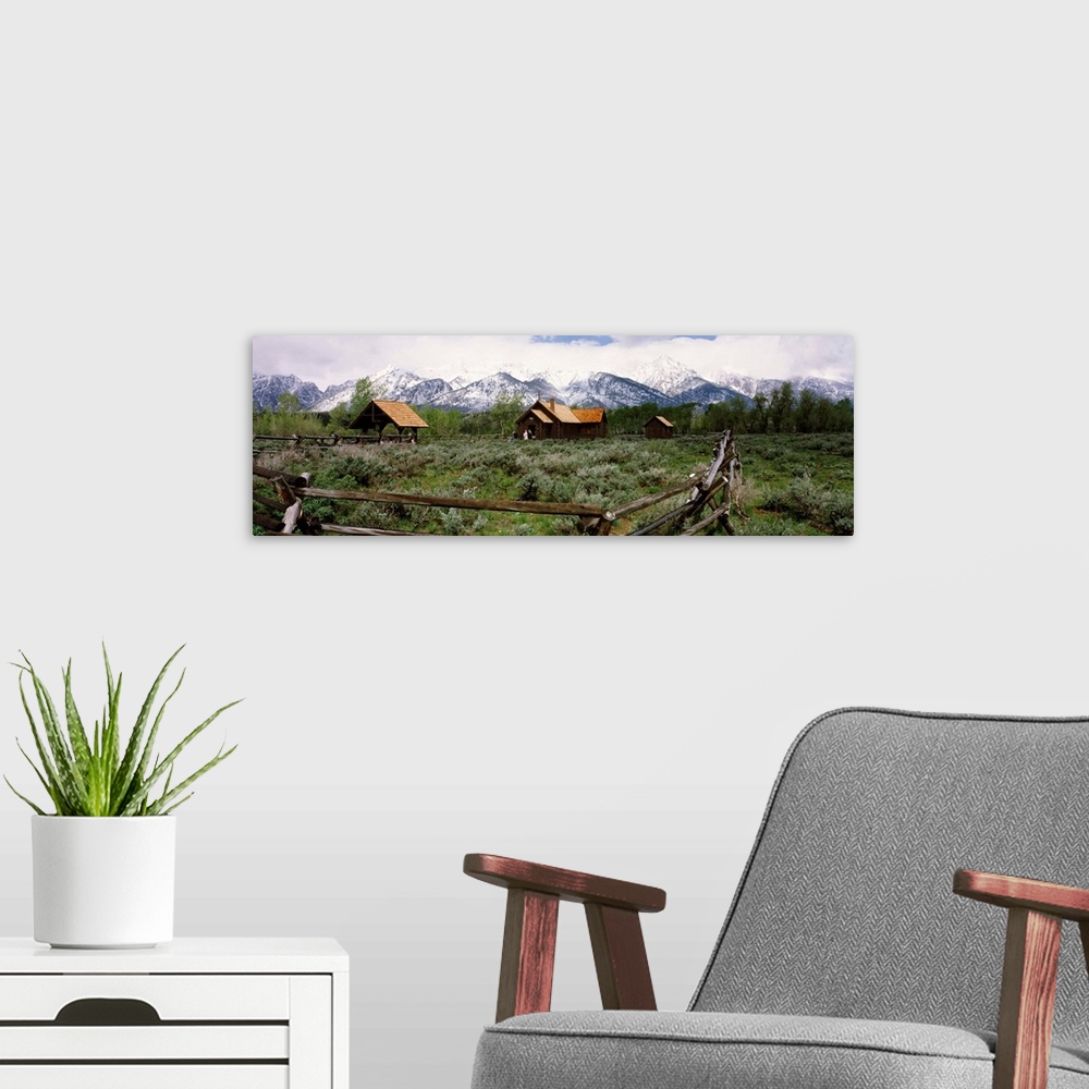 A modern room featuring Chapel with a mountain range in the background, Chapel of the Transfiguration, Grand Teton Nation...