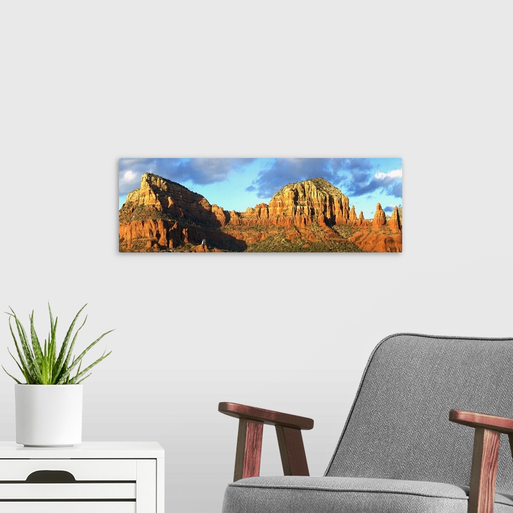 A modern room featuring Long image of rock formations and canyons in Arizona printed on canvas.