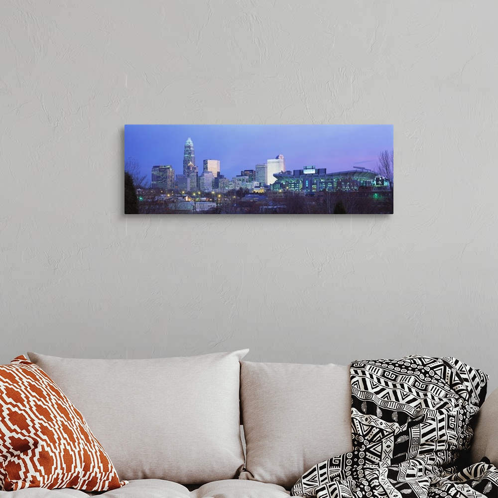 A bohemian room featuring Downtown skyline of Charlotte, North Carolina, featuring the Ericsson Stadium. This photograph wa...